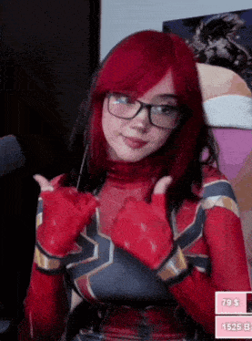 a woman with red hair is wearing a spiderman costume and giving a thumbs up