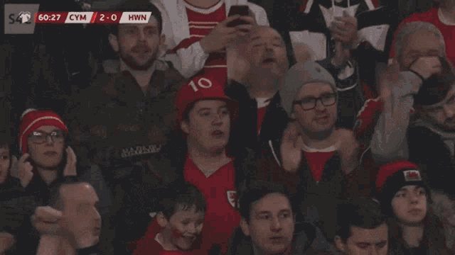 a man wearing a red hat with the number 10