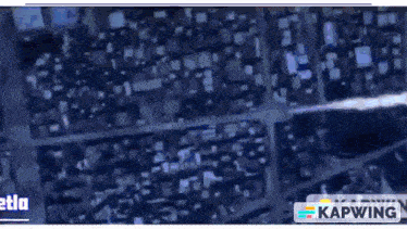 an aerial view of a city at night with the word kapwing on the bottom