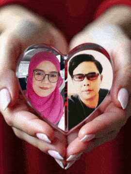 a woman holding a heart with a picture of a man and a woman in it