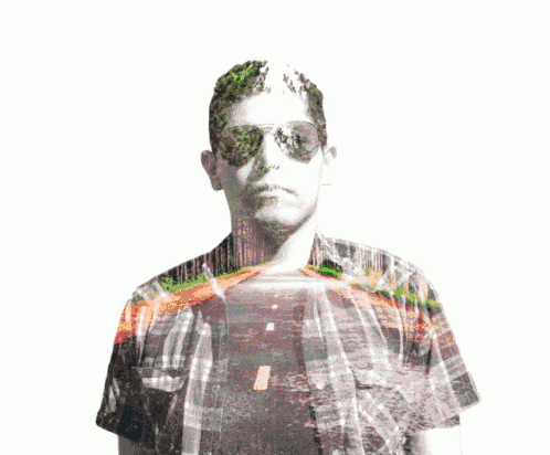 a man wearing sunglasses and a plaid shirt has a picture of a forest on his shirt