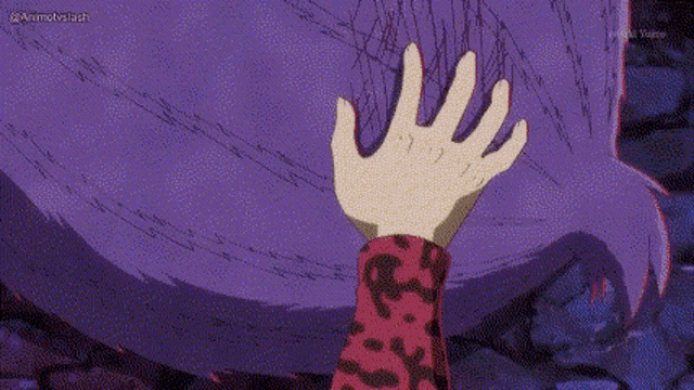 a person 's hand is reaching out to touch a purple animal 's fur .
