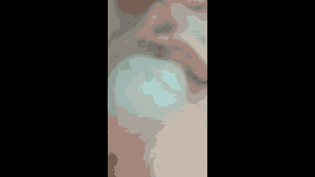 a close up of a person 's face behind a white cloth