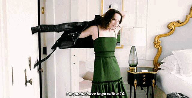 a woman in a green dress says i 'm gonna have to go with a 10 ..