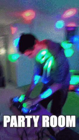 a man playing music in a party room with the words party room above him