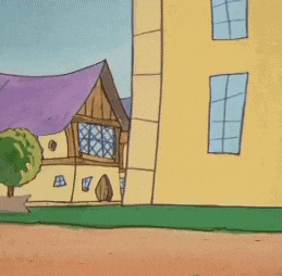 a cartoon character standing in front of a yellow building