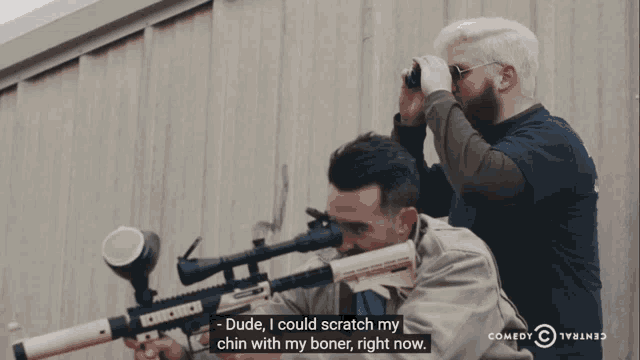 a man holding a gun with the words dude i could scratch my chin with my boner right now below him