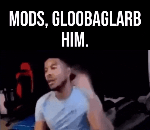a man is sitting in a dark room with his fist in the air and the words `` mods , gloobaglarb him . ''