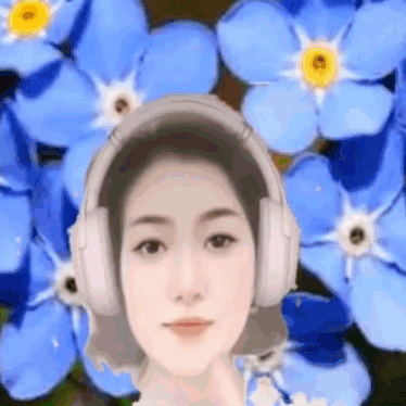a woman wearing headphones is standing in front of a field of blue flowers .