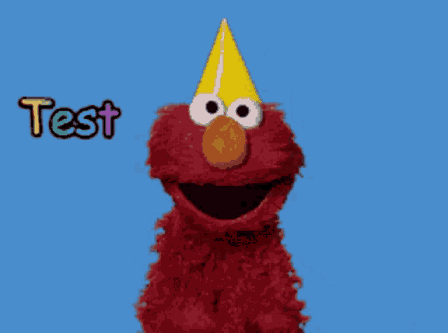 elmo from sesame street is standing in front of a blue sky and the word test is written above him