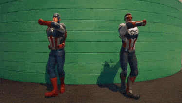 a man in a superhero costume stands next to another man in a superhero costume