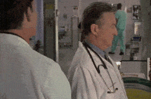 a man in a lab coat with a stethoscope around his neck