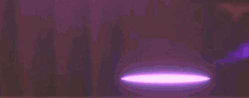 a person is standing in front of a large fireball in a video game