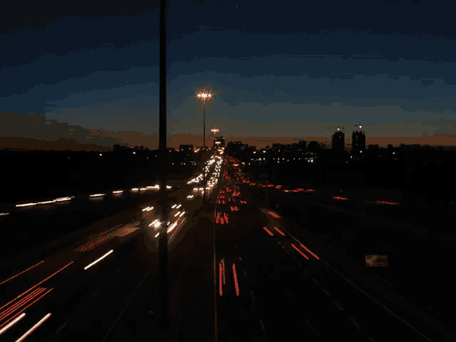 a busy highway at night with a lot of lights on