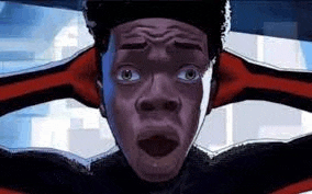 a close up of a person 's face with a surprised look on it .