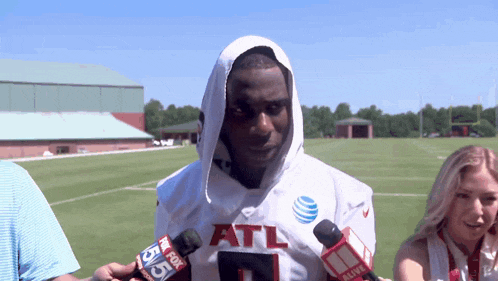 a man in an atl jersey is being interviewed by fox 55