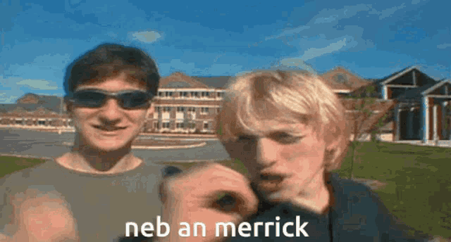 two men are standing next to each other and one of them is pointing at the camera with the words neb an merrick above them