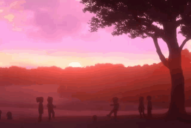 a group of children are standing in front of a tree at sunset
