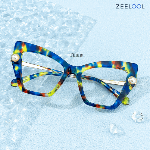 a pair of blue and yellow glasses with pearls and the word tilana on the bottom