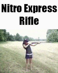 a woman is holding a rifle in a field with nitro express rifle written on the bottom