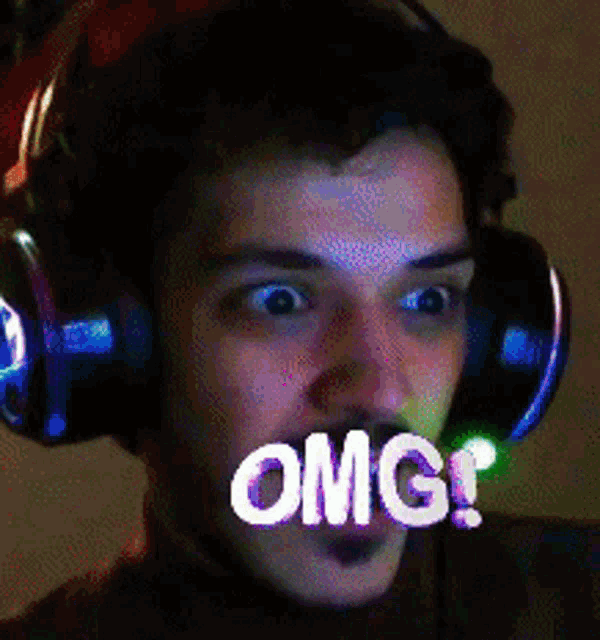 a man wearing headphones with a surprised look on his face says omg