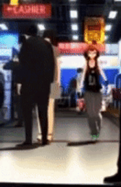 a blurred image of people walking in a store with a sign that says cashier