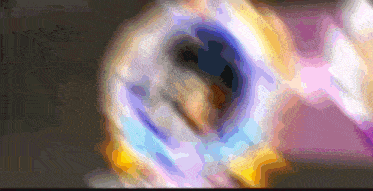 a blurred image of a person 's face with a purple and yellow background