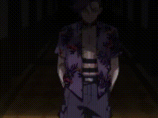 a man is wearing a purple shirt with a floral pattern .