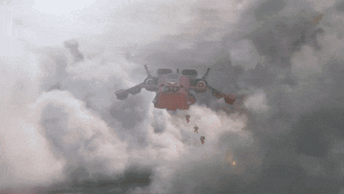 a robot is flying through a cloudy sky with a few people hanging from it