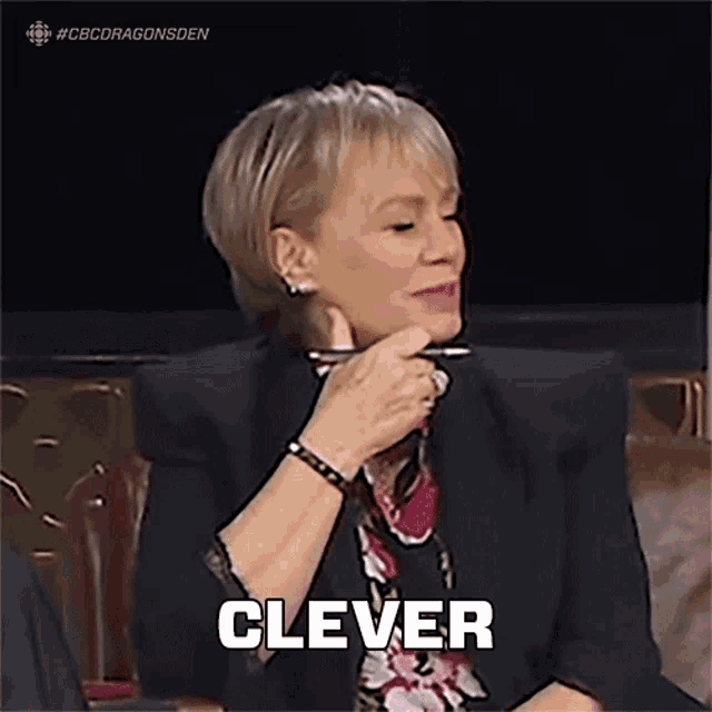 a woman sitting in a chair with her hand on her chin and the word clever above her