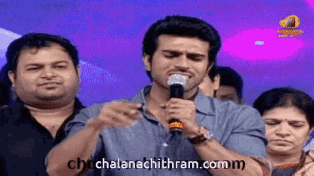 a man singing into a microphone with the website chchalanachithram.comm