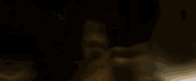 a man without a shirt is holding a knife in his hand