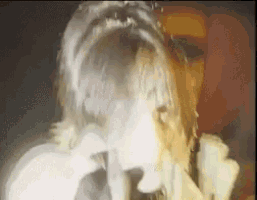 a close up of a person 's face with a smoke coming out of it