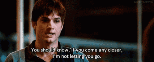 a man in a dark room says you should know if you come any closer i 'm not letting you go