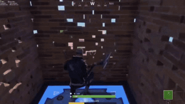 a person playing a video game with the letter w on the screen