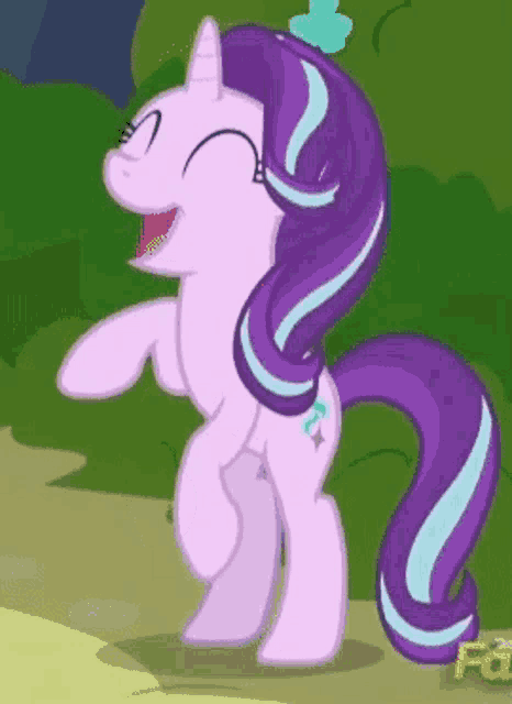 a cartoon pony with a purple mane and tail is standing on its hind legs and laughing .