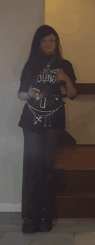 a girl wearing a black t-shirt that says quake