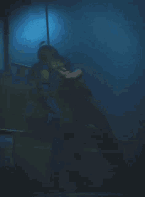 a man in a police uniform is holding a woman in his arms