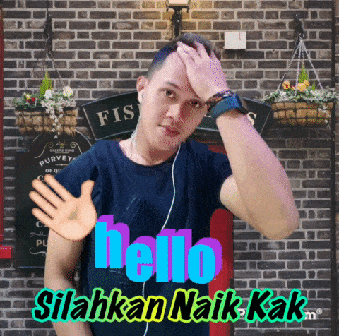 a man wearing ear buds and a black shirt with the word hello on it