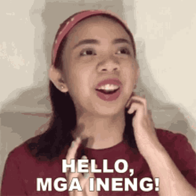 a woman is making a funny face and saying `` hello , mga ineng '' .