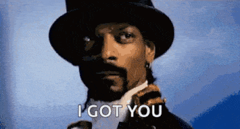 snoop dogg is wearing a top hat and a suit and has the words `` i got you '' written on his face .