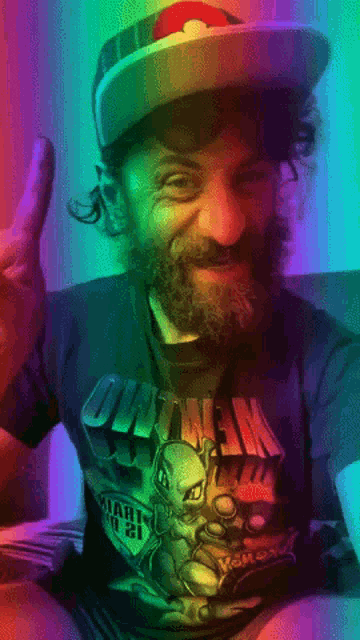 a man with a beard is wearing a shirt that says pokemon on it