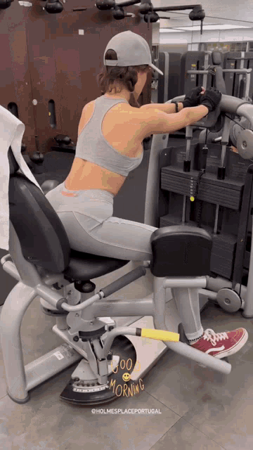 a woman is using a machine that says good morning on the bottom