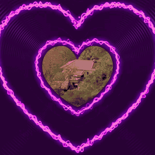 a purple heart with a picture of a house inside