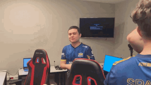 a man wearing a blue shirt with the word spa on it