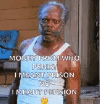 a man in a tank top is standing in front of a building with a funny caption .