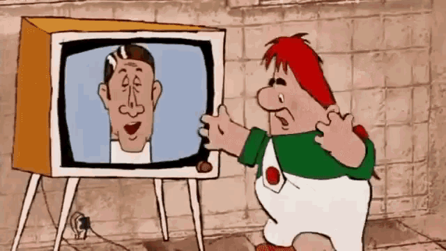 a cartoon character is standing in front of a television with a picture of a man on it .