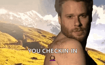 a shirtless man with a tattoo on his arm says you checkin ' in