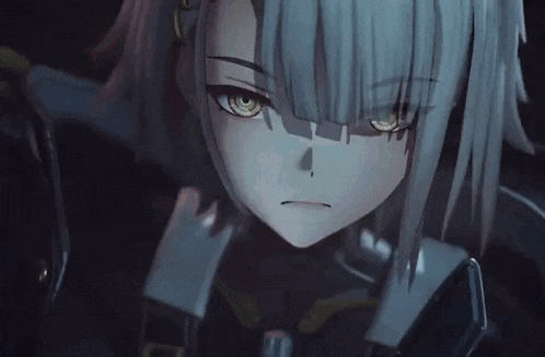 a close up of a girl with gray hair and green eyes in a dark room .