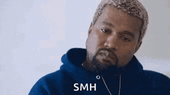 kanye west is wearing a blue hoodie and a necklace while making a funny face .